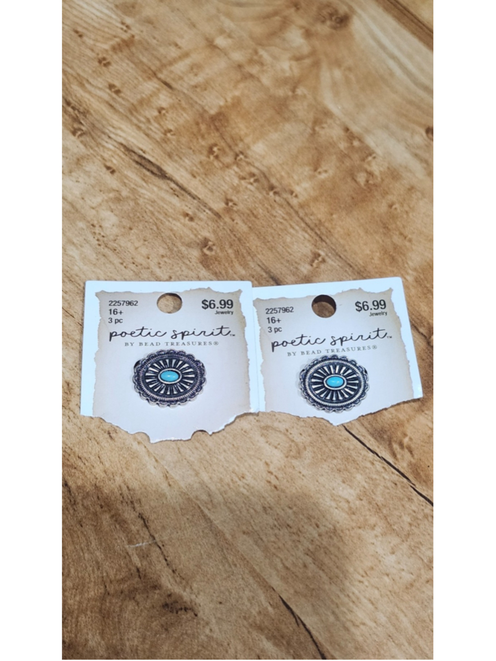 2 matching small western style silver toned and turquoise pins